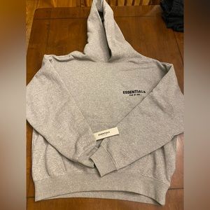 Men’s small fear of god essentials hoodie in dark oatmeal. Brand new with tags.